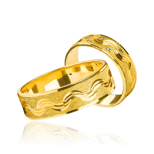 Argollas de matrimonio Ondas de Cristal, elaboradas en oro 18k por Joyería Caracas. Cada argolla cuenta con un certificado de calidad y garantía para toda la vida.