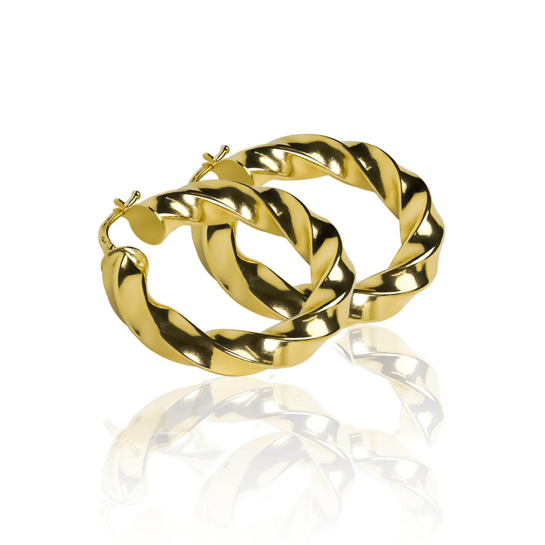 Candongas melcocha Spira L fabricadas en oro 18k por Joyería Caracas, cuenta con una garantía para toda la vida.