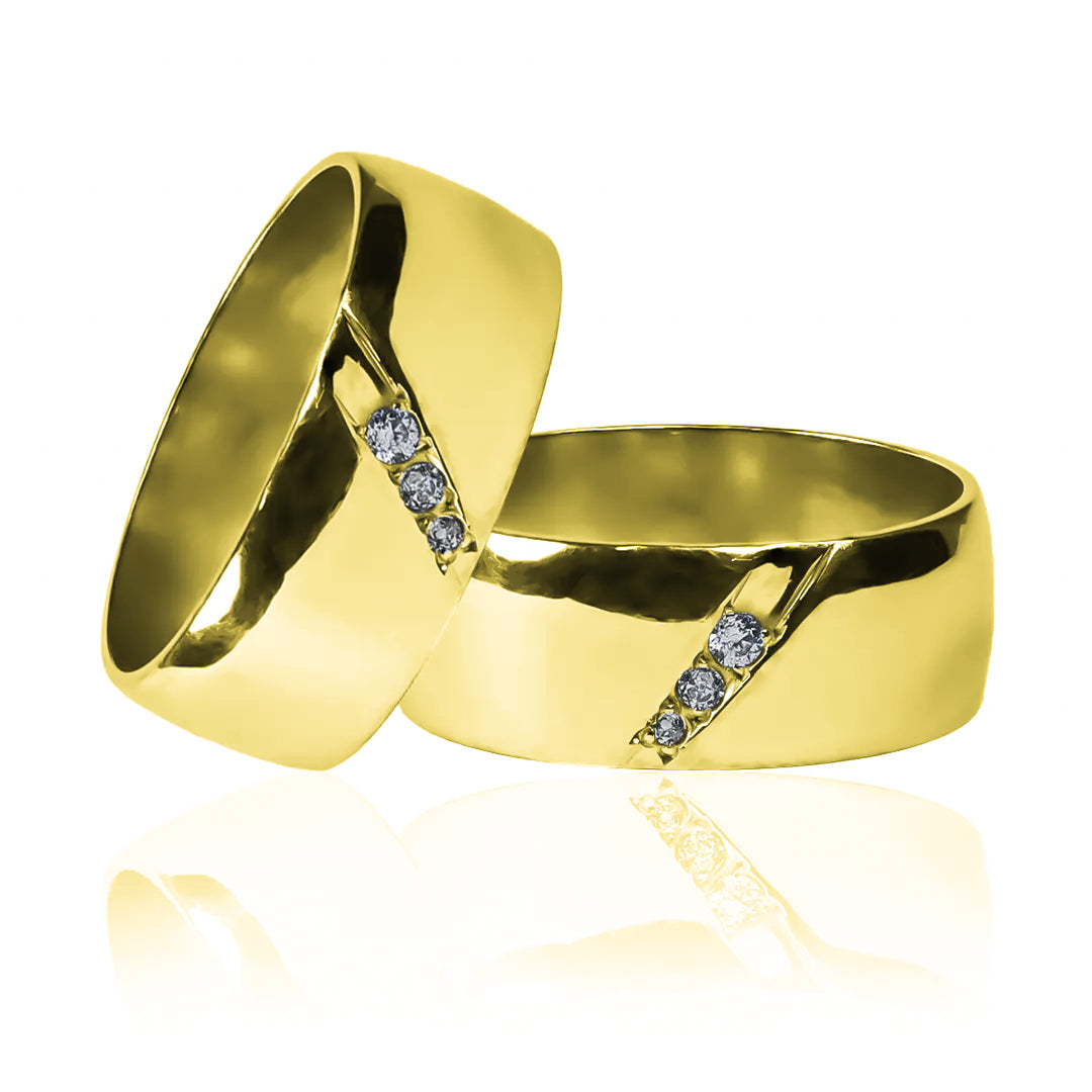 Argollas de matrimonio clásica canal, fabricadas en oro 18k de Joyería Caracas, cuentan con garantía de por vida.