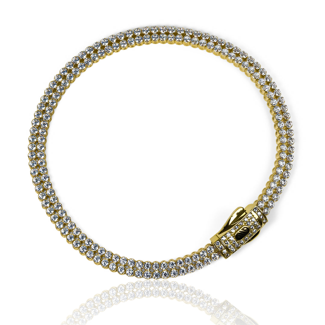 Pulsera Monaco cristales dobles fabricada en oro 18K por Joyería Caracas. Además, cuenta con garantía para toda la vida, asegurando su calidad y durabilidad.